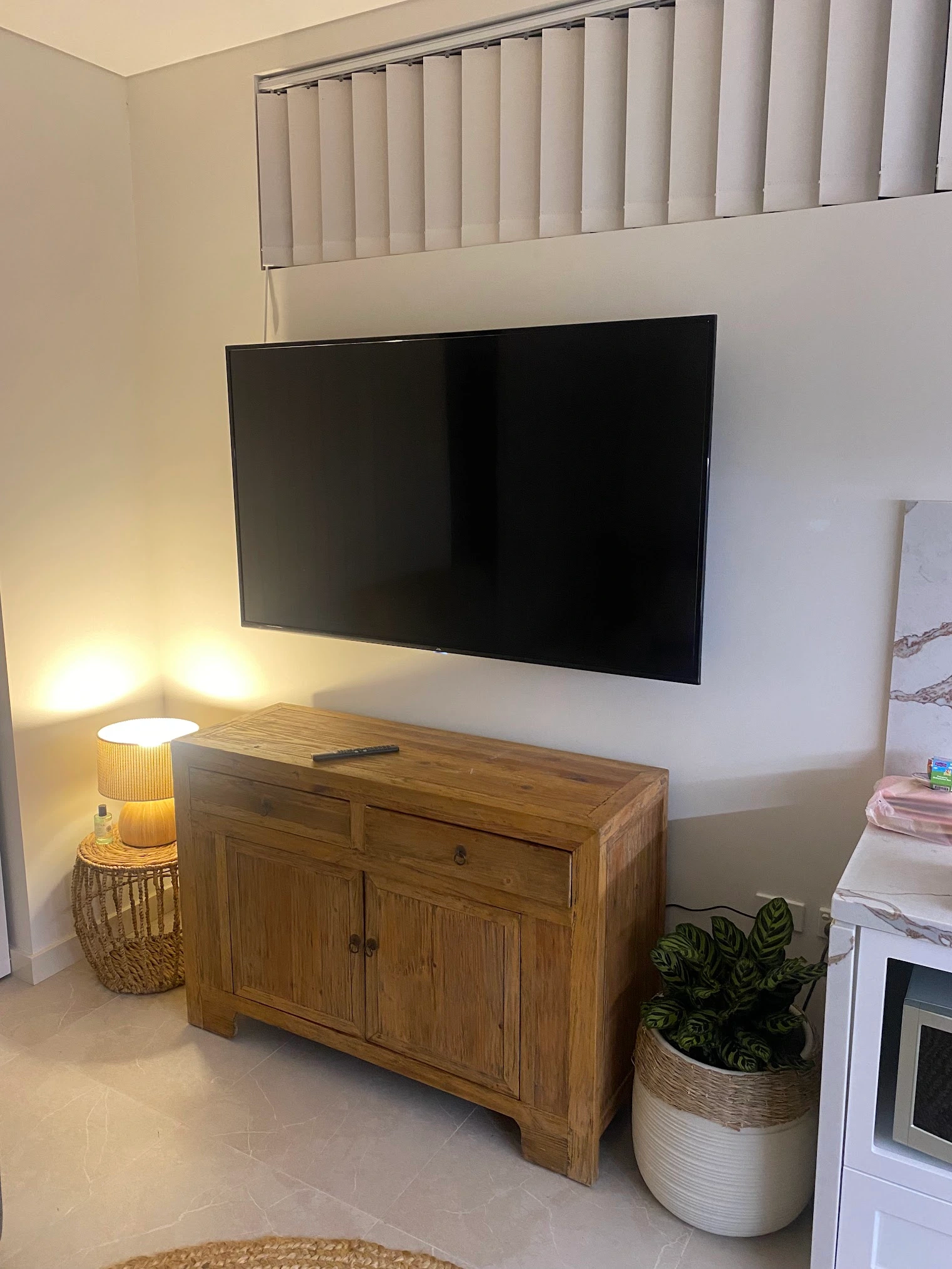Apartment TV mounting on a concrete wall